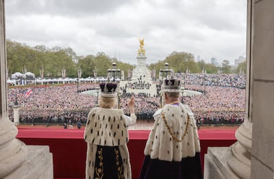 King Charles III and Queen Camilla wave from the balcony of Buckingham Palace. Getty/Buckingham Palace