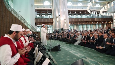 Turkish President Recep Tayyip Erdogan (back-C), praying on the third anniversary of the failed coup attempt at the Millet (Nation) mosque in Ankara, Turkey. EPA