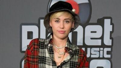 The former child star Miley Cyrus. AP Photo / dpa, Boris Roessler