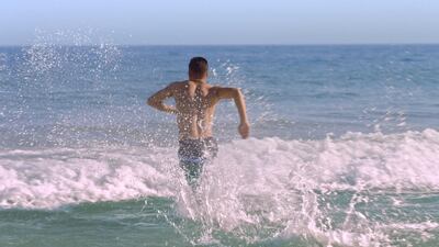 The four Syrian refugees had never been to the beach before they moved to Brazil. Courtesy The Black Pearls Academy