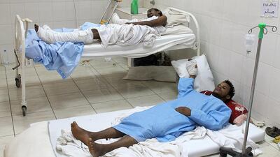 Wounded Yemeni men rest in the Al Sadaka hospital in Aden on July 5, 2015. Saleh Obeidi/AFP Photo
