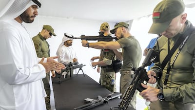 Belarus SWAT team members inspect weapons. Antonie Robertson / The National