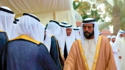 Sheikh Tahnoun bin Mohammed, Abu Dhabi Ruler’s Representative in the Eastern Region, greets the grooms at the mass wedding in Emirates Palace on Tuesday. Wam