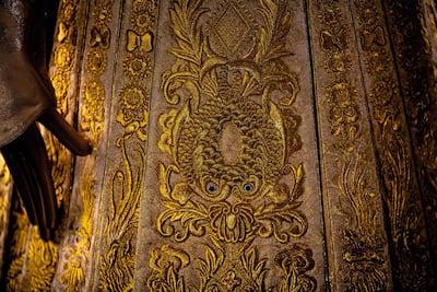 The dress is replete with marital motifs, such as the double fish on the front panel. Photo: Sotheby's