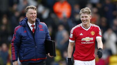Manchester United manager Louis van Gaal alongside Bastian Schweinsteiger after Saturday's win over Watford. John Sibley / Reuters