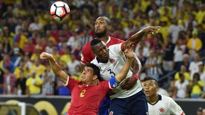 Colombia’s Yerry Mina, centre, vies for the ball with Costa Rica’s Johnny Acosta, left, and Kendall Waston. Nelson Almeida / AFP