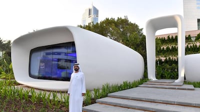 Sheikh Mohammed bin Rashid, Vice President and Ruler of Dubai, stands outside the 3D printed building on the Emirates Towers premises which houses Dubai Future Academy. Wam