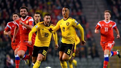 Belgium's Eden Hazard, left, and Youri Tielemans, right, run after the ball. AFP