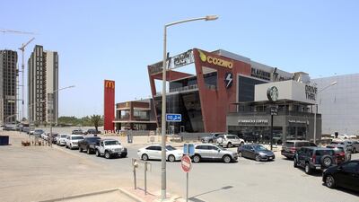 Vehicles queue in front of a drive-through fast food restaurant in Kuwait City. AFP