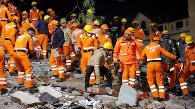 Rescue members remove the debris after a residential apartment block collapsed in Lucknow, India, January 24, 2023. REUTERS / Pawan Kumar