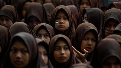 Pupils at an Islamic school recite the Quran and pray for Palestinians, in Banda Aceh, Indonesia. AFP