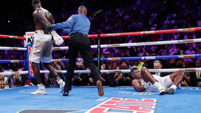 Deontay Wilder walks away after knocking down Luis Ortiz. AP