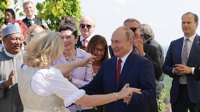 Russian President Vladimir Putin dances with Austrian foreign minister Karin Kneissl during her wedding to businessman Wolfgang Meilinger in Gamlitz, Austria. EPA