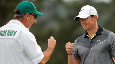 Rory McIlroy, right, with his former caddie JP Fitzgerald. Brian Snyder / Reuters