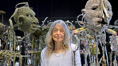 Fiona Hall with her artwork Wrong Way Time, which is on display at the Australian pavilion at Venice Biennale. Andrea Merola / EPA