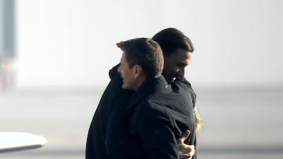 Ibrahimovic is welcomed by AC Milan's chief football officer Zvonimir Boban. AFP