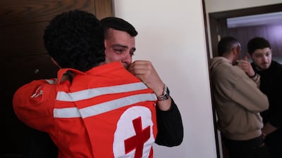 Colleagues of Hassan Ali Badawi, a paramedic with the Lebanese Red Cross who was killed in an Israeli air strike, mourn with his family at their home near Bchamoun, south of Beirut. AFP