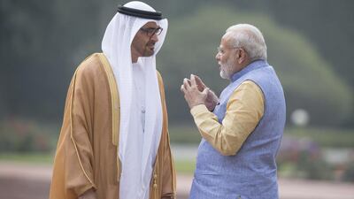 Sheikh Mohammed bin Zayed, Crown Prince of Abu Dhabi and the Deputy Supreme Commander of the UAE Armed Forces, left, talks to Indian prime minister Narendra Modi at Hyderabad House. Hamad Al Kaabi / Crown Prince Court - Abu Dhabi