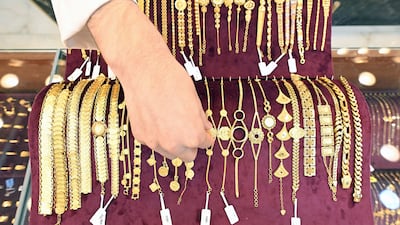 A Kuwaiti jeweller arranges gold items at a shop in downtown Kuwait City. AFP