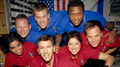 January 2003: crew members in the SPACEHAB Research Double Module aboard the Space Shuttle Columbia. This picture was on a roll of unprocessed film later recovered by searchers from the debris. From the left (bottom row), wearing red shirts to signify the???