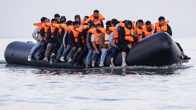 Migrants on a boat off the coast of northern France attempting to cross the English Channel. AFP