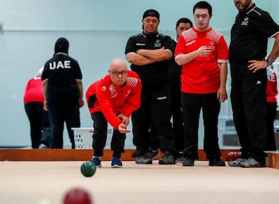 Mahmoud Jaharoo rolls the ball during a training session for the UAE Bocce team in Al Ain. Victor Besa / The National
