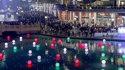 With 2,020 days to go until the start of the 2020 Expo in Dubai, an event was held at Dubai Fountain where members of the public could register and write their wishes on an LED ball, which was then set afloat in the lake. Antonie Robertson / The National
