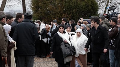People attend the funeral ceremony for French police officer Ahmed Merabet, a Muslim, whose last moments were captured on film as one of the gunmen shot him in the head while he lay wounded, pleading for life. Joel Saget / AFP Photo