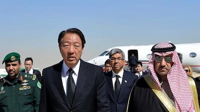 Singapore's deputy prime minister Teo Chee Hean, left, arrives in Riyadh airport and is met by the governor of the Riyadh province, Turki bin Abdullah Al Saud, right. Saudi Press Agency/AP Photo