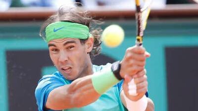 Rafael Nadal of Spain returns a ball to Robin Soderling of Sweden.