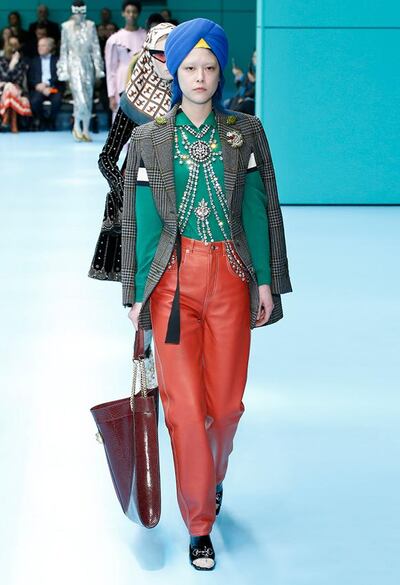 A model wears a turban on the Gucci FW18 runway