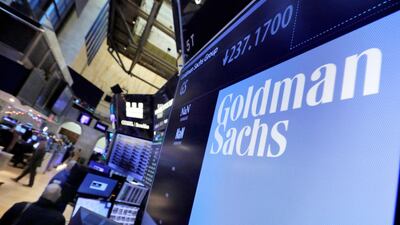 Goldman Sachs is expecting a $5 billion hit to profits during the fourth quarter because of the tax overhaul recently signed into law. (AP Photo/Richard Drew, File)