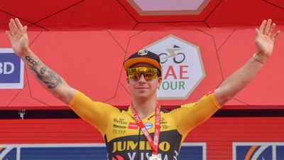 Jumbo Visma rider Dylan Groenewegen celebrates on the podium after winning stage four of the UAE Tour in Dubai on Wednesday. AFP