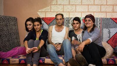 From left: Hilda, 16, Amal, 13, Suhaib, 46, Obyda, 13, and Abir, 42, Palestinians from Yarmouk refugee camp in Damasucs, now living in Burj Barajneh refugee camp in Beirut, Lebanon. Andrew McConnell for The National