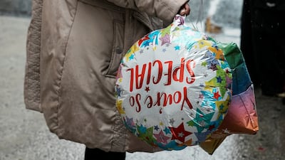 A woman awaits the arrival of relatives via a US government chartered flight at John F Kennedy International Airport on Thursday. Reuters