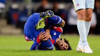 Basel's Egyptian midfielder Mohamed Salah reacts in pain during an UEFA Champions League football match between FC Basel and Steaua Bucharest, in Basel. Fabrice Coffrini / AFP