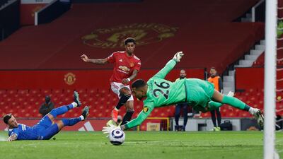 Manchester United's Marcus Rashford scores his side's opening goal during the English Premier League soccer match between Manchester United and Brighton and Hove Albion at Old Trafford, Manchester, England. AP