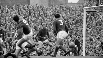 Denis Law in action against Arsenal. Getty
