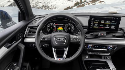 The steering wheel and dashboard set-up.