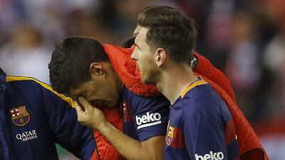 Barcelona striker Luis Suarez leaves the field in tears during Sunday's Copa del Rey final against Sevilla. Francisco Seco / AP Photo