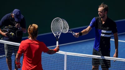 Daniil Medvedev greets J.J. Wolf at the net after their US Open third round match. AP Photo