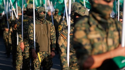 Members of the Popular Mobilisation Forces carry flags for a funeral procession in Baghdad. AFP