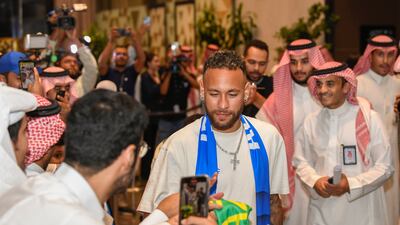 Neymar is surrounded by fans after his arrival at the King Khalid International Airport in Riyadh. AP
