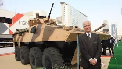 Philippe Burtin, chairman and chief executive of Nexter stands in front of VBCI,combat armoured infantry carrier. Ravindranath K / The National