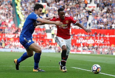 Soccer Football - Premier League - Manchester United vs Leicester City - Manchester, Britain - August 26, 2017 Manchester United's Anthony Martial in action with Leicester City's Harry Maguire REUTERS/Andrew Yates EDITORIAL USE ONLY. No use with unauthorized audio, video, data, fixture lists, club/league logos or "live" services. Online in-match use limited to 45 images, no video emulation. No use in betting, games or single club/league/player publications. Please contact your account representative for further details.