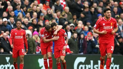 LIVERPOOL, ENGLAND - MARCH 01: Philippe Coutinho #10 of Liverpool celebrates with teammate Jordan Henderson of Liverpool after scoring his team's second goal during the Barclays Premier League match between Liverpool and Manchester City at Anfield on March 1, 2015 in Liverpool, England. (Photo by Clive Brunskill/Getty Images)