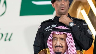King Salman arrives at Riyadh airport accompanied by his personal bodyguard Maj Gen Abdulaziz Al Fagham. AFP