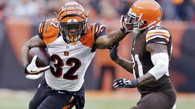 Jeremy Hill and the Bengals lead the AFC North division with two weeks remaining in the NFL season. Tony Dejak / AP / December 14, 2014