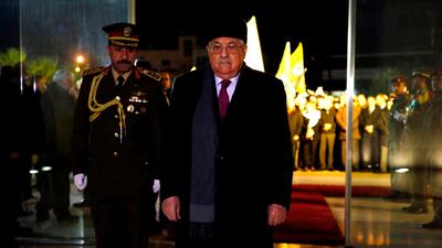 Palestinian president Mahmoud Abbas stands before the tomb of the late president Yasser Arafat during a celebration marking the 53rd anniversary of the creation of the Fatah movement, in the West Bank city of Ramallah on December 31, 2017. Abbas Momani / AFP