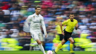 Cristiano Ronaldo of Real Madrid runs with the ball against Valencia. Gonzalo Arroyo Moreno / Getty Images